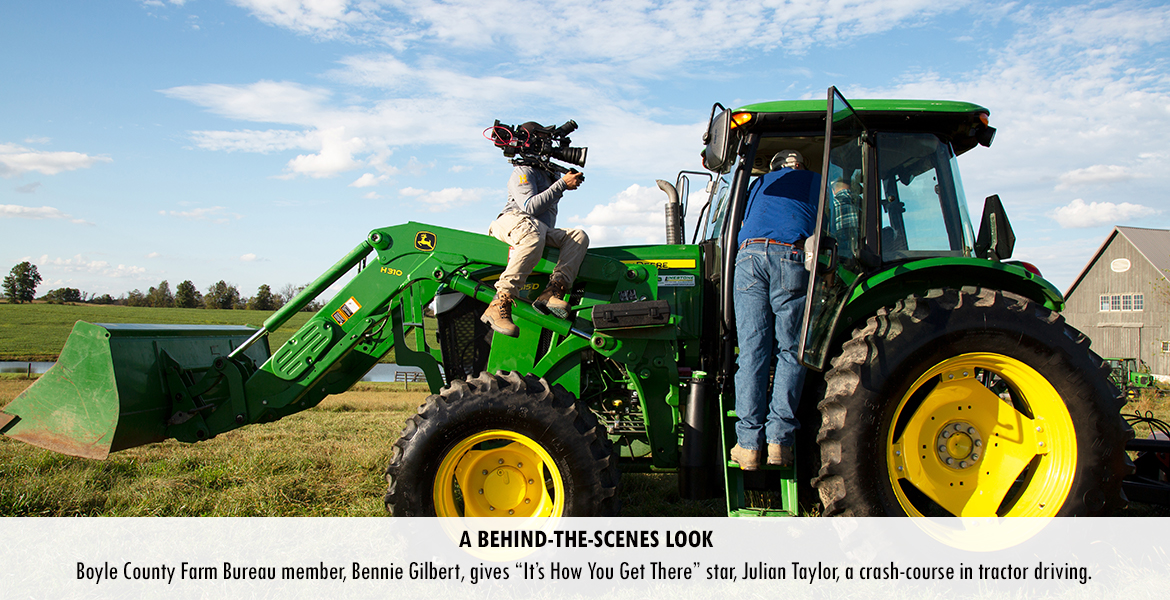 Boyle County Farm Bureau member, Bennie Gilbert, gives "It's How You Get There" star, Julian Taylor, a crash-course in tractor driving.