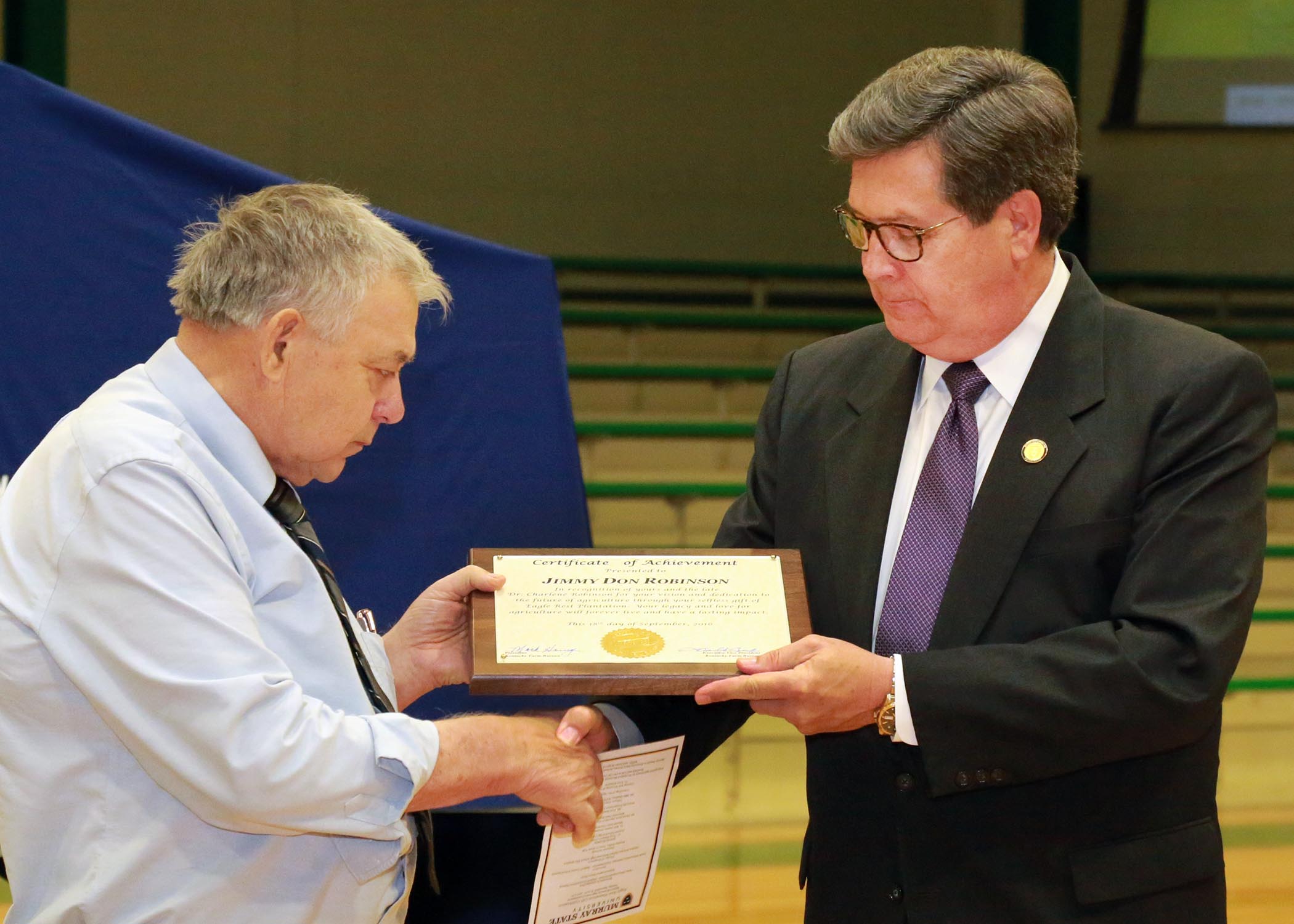 KFB Executive Vice-President David Beck presented Judge Robinson with a Certificate of Achievement during the dedication ceremony KFB Executive Vice-President David Beck presented Judge Robinson with a Certificate of Achievement during the dedication ceremony
