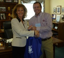 State Rep. Martha Jane King receives a food basket of KY food products from Logan County Farm Bureau President Jeremy Robertson. State Rep. Martha Jane King receives a food basket of KY food products from Logan County Farm Bureau President Jeremy Robertson.