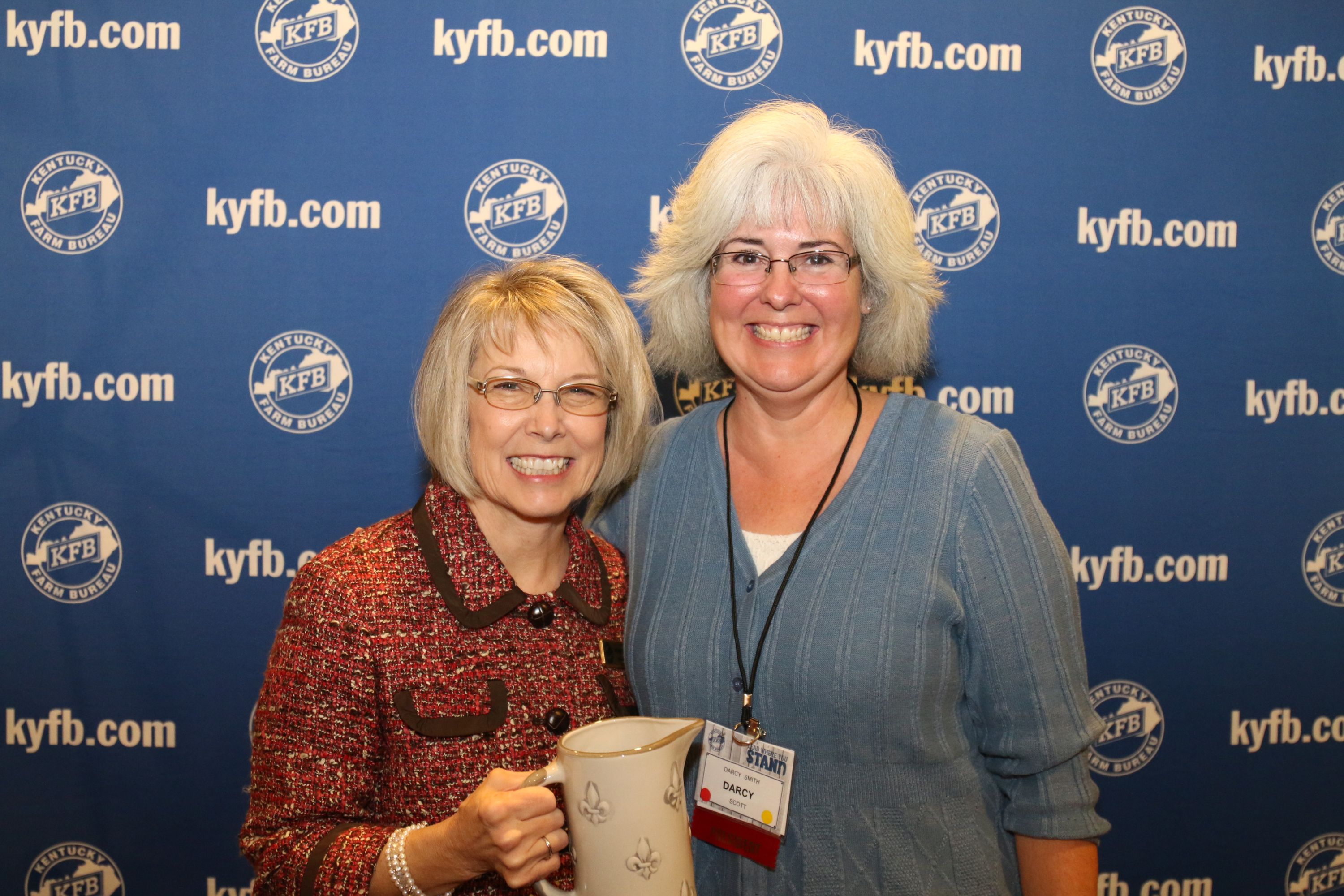 Darcy Smith of the Scott County Farm Bureau Women's Committee, accepts the 2017 Gold Star Award of Excellence from Vicki Bryant, chair of the Kentucky Farm Bureau state Women's Committee. Darcy Smith of the Scott County Farm Bureau Women's Committee, accepts the 2017 Gold Star Award of Excellence from Vicki Bryant, chair of the Kentucky Farm Bureau state Women's Committee.