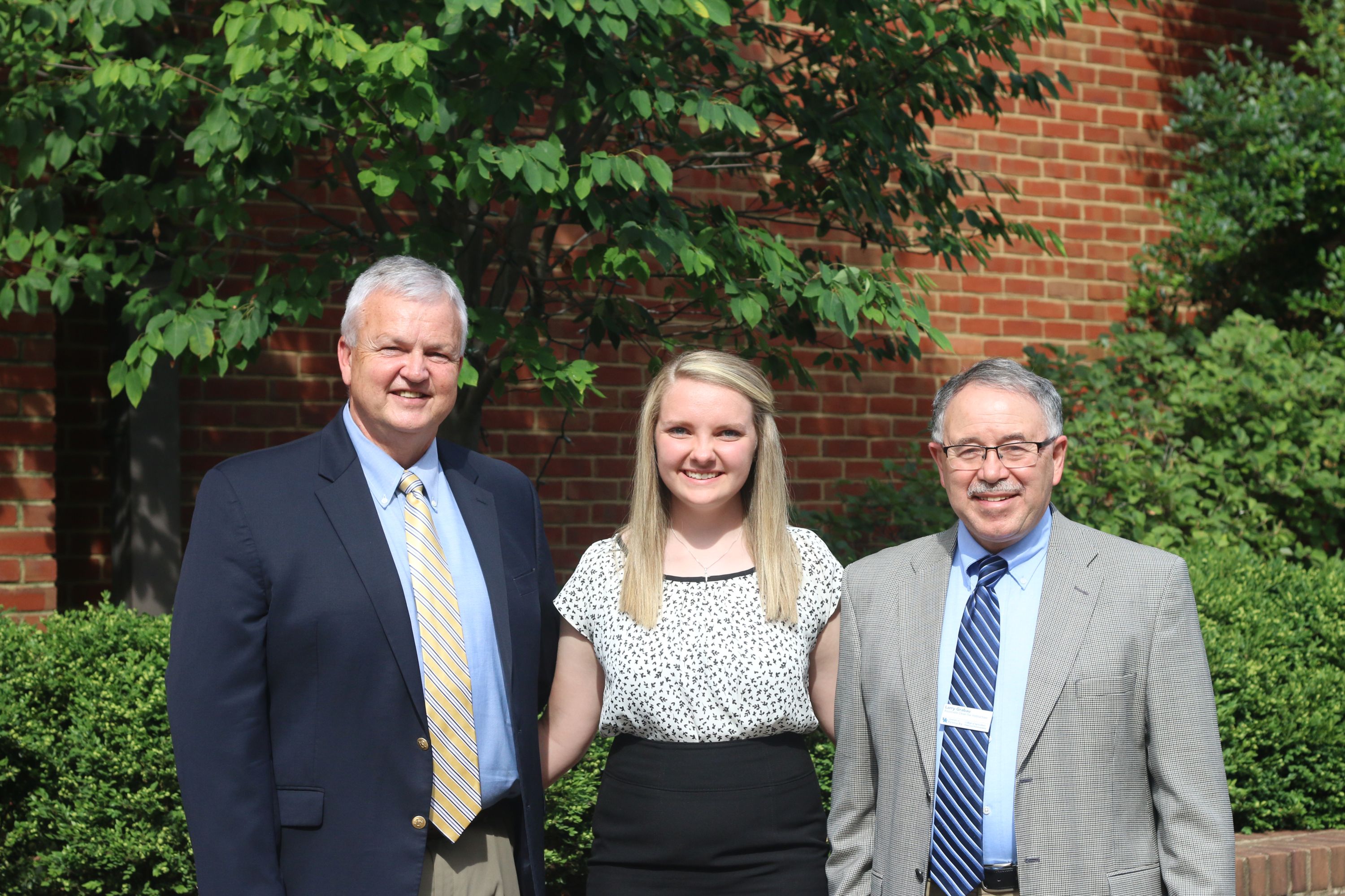 Clarissa Mackey (center) is greeted by Joe Cain, Kentucky Farm Bureau Director of Commodities (left), and Dr. Larry Grabau, Associate Dean for Academic Programs of the University of Kentucky College of Agriculture, Food and Environment (right), during the 2017 Institute for Future Agricultural Leaders (IFAL). Clarissa Mackey (center) is greeted by Joe Cain, Kentucky Farm Bureau Director of Commodities (left), and Dr. Larry Grabau, Associate Dean for Academic Programs of the University of Kentucky College of Agriculture, Food and Environment (right), during the 2017 Institute for Future Agricultural Leaders (IFAL).